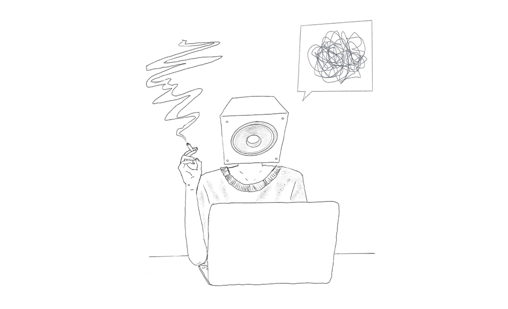 Speakerhead's mascot, the Speakerhead, smoking a cigarette while working on his laptop.